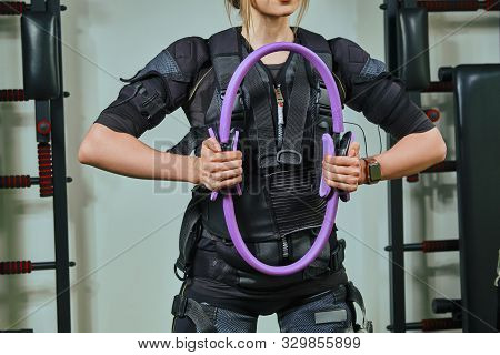 Beautiful Blonde Woman Wearing In Sensors And Belts, Fastens With Velcro Is Practicing Ems Fitness I