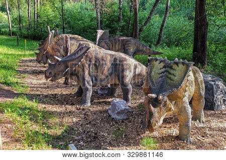 Belgorod, Russia - May 31, 2019: Herd Of Robotic Hasmosaurs Statue In The Forest Of Belgorod Dinopar