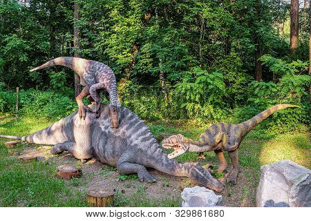 Belgorod, Russia - May 31, 2019: Full-size Deinonychus Statues In The Forest Of Belgorod Dinopark. T