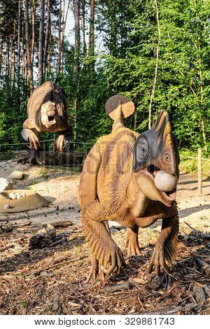 Belgorod, Russia - May 31, 2019: Full-size Oviraptor Statue In The Forest Of Belgorod Dinopark. Egg 