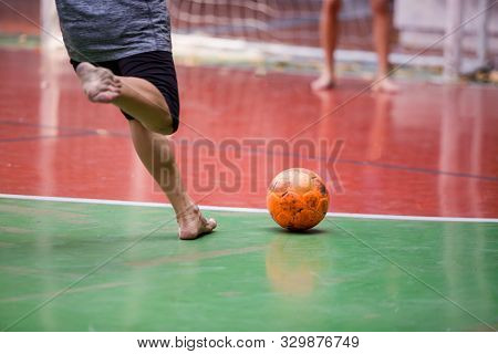 Futsal Players Barefoot. Futsal Player  Control And Shoot Ball To Goal.