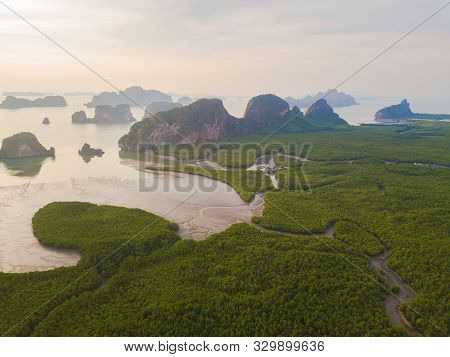 Aerial Top View Of Samet Nangshe, Mountain Valley Hills, And Tropical Green Forest Trees At Sunset W