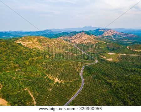 Aerial Top View Of Samet Nangshe, Mountain Valley Hills, And Tropical Green Forest Trees At Sunset W