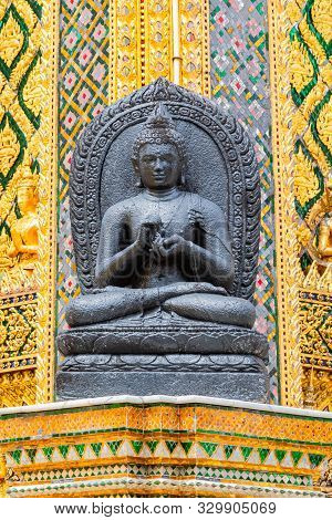 A Black Buhhda Statue Adorns One Of The Buildings In The Wat Phra Kaew Complex.