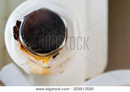 Point Of Leakage. Bottom Plug Of A Central Heating Radiator. Oxidation On A Frame.
