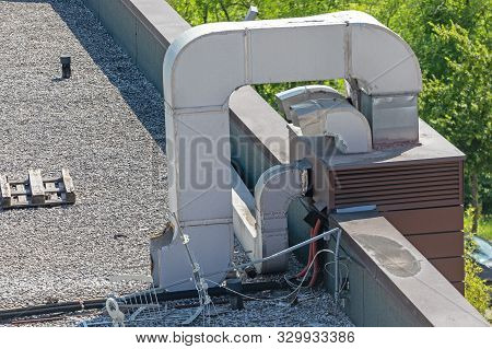 Air Duct Hvac At Gravel Flat Roof Building