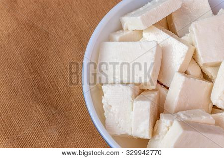 Paneer Cottage Cheese Close Up, Slice Pieces Of Homemade Fresh White Raw Panner Cheese.