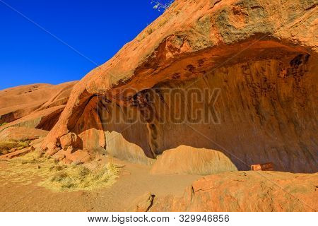 Uluru, Northern Territory, Australia - Aug 23, 2019: Popular Mala Walk With Wave Shaped Rock Formati