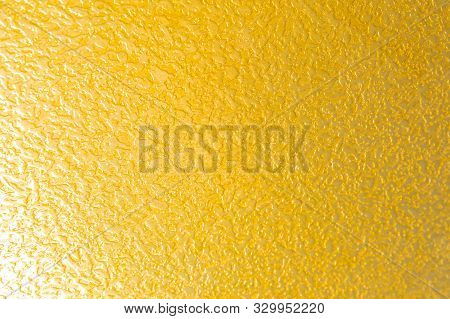 Bright Yellow Textured Grainy Surface, Lemon Like Pattern Close-up