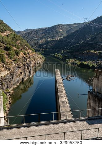 Solid Structure Of The Valeira Dam On River Douro In Portugal Looking Down Into The Gorge