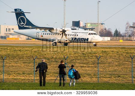 Prague, Czech Republic - March 14, 2014. People Watching Airplanes Landing And Taking Off At The Air