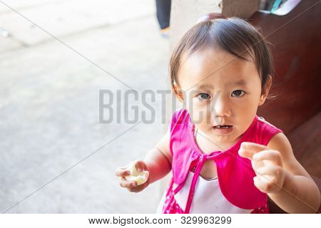 Little Adorable Asian Kid Eating Boiled Egg