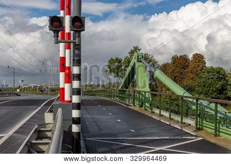 Drawbridge Over Dutch River Vecht With Traffic Lights And Barrier