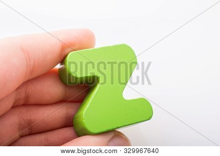 Hand Holding Letter Cube Z Of Made Of Wood