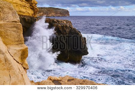Huge Waves Crash On Cloudy Day. Kemmuna Island
