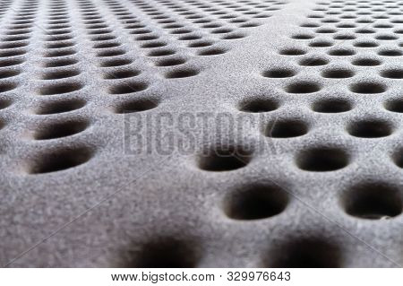 Close Up Of Safety Plate With Antiskid Holes For Traction For Use As Grunge Background