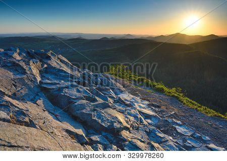 Warm Early Morning Sunlight Bursting Over The Mountain Peak Of Klic Mountain