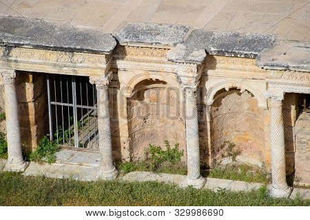 Antique Columns And Arches In The Hierapolis Amphitheater. Ancient Antique Amphitheater In The City 