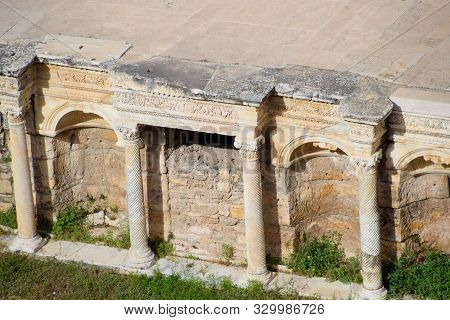 Antique Columns And Arches In The Hierapolis Amphitheater. Ancient Antique Amphitheater In The City 