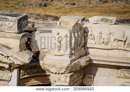 Bas-reliefs Of Antique Scenes On The Gables Of The Amphitheater In Hierapolis, Turkey. Ancient Antiq