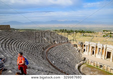 Pamukkale, Hierapolis, Turkey - May 22, 2019: Tour Groups On The Ruins Of Hierapolis. Tourists Are S