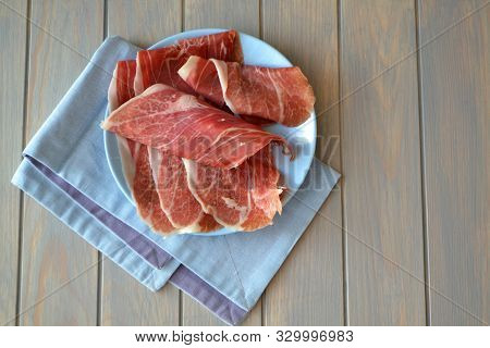 Raw Ham. Raw Marbled Beef Steaks On Blue Planks Table