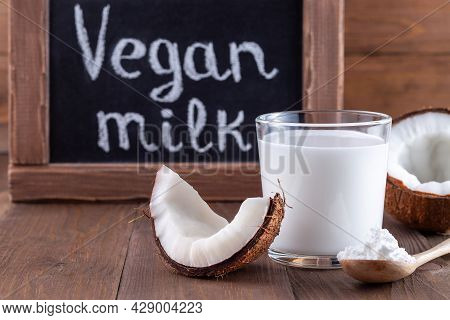 Coconut Milk In Powder And Dissolved With Water In A Glass, Lactose Free Milk And Chalk Board On A W