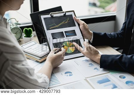 The Head Of The Finance Department Presents The Financial Information To The Executives, The Company