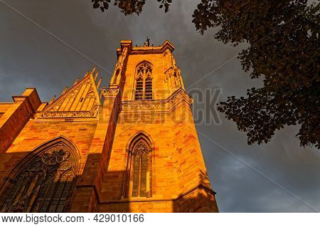 Colmar, France, June 25, 2021 : Cathedral Bell Tower At Sunset Light. City Has A Rich Architectural 
