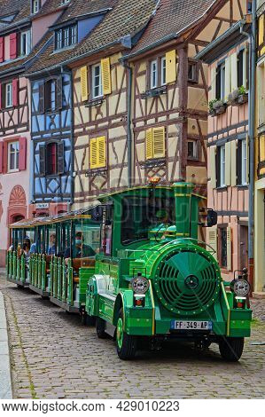 Colmar, France, June 27, 2021 : Small Tourist Train In Old Streets. City Has A Rich Architectural He
