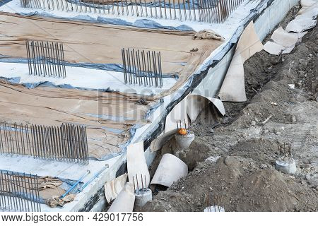 Closeup Of House Foundation Made From Concrete Shuttering Blocks Filled With Mortar And Reinforcemen