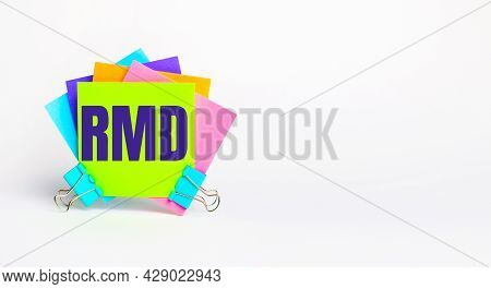 There Are Bright Multi-colored Stickers With The Text Rmd Required Minimum Distributions On A White 