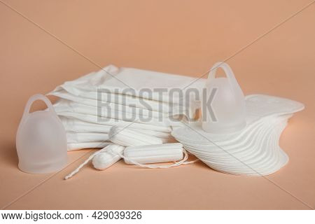Menstrual Pads And Other Period Products On Pale Orange Background
