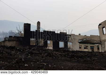 Fire Debris Of Houses In A Small Town With Smoke In Sky. Caused By Forest Wildfires In Lytton, Briti