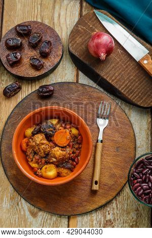 Jewish Dish Shuttle With Meat On The Table In A Plate Near The Ingredients. Vertical Photo