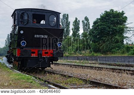 Neuf-brisach, France, June 27, 2021 : A Group Of Volunteers Operates Old Steam Or Electric Locomotiv