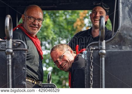 Neuf-brisach, France, June 27, 2021 : A Group Of Volunteers Operates Old Steam Or Electric Locomotiv