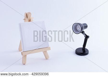 Wooden Easel Miniature With Blank White Square Canvas For Artists And Painters - Mockup. Mini Wooden