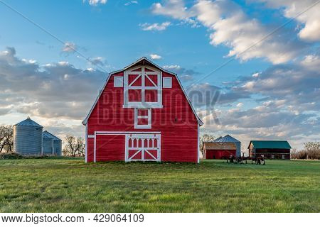 Vintage Red Barn In A Farmyard On The Prairies In Saskatchewan