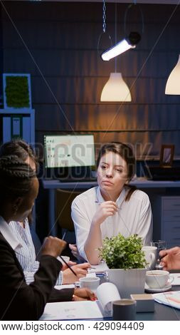 Businesswoman Leder Sitting At Desk Analyzing Marketing Presentation Discussing Financial Graps Pape