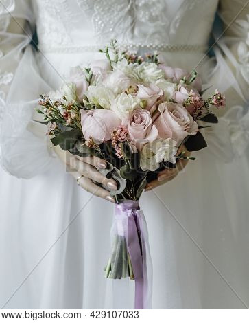 Woman With Bridal Bouquet. Eremony Wedding Day. Hands With Wedding Rings.