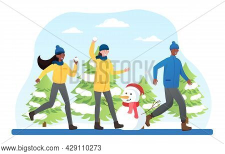 Young Mixed Racial People In Warm Clothes Have Fun Doing Winter Acivities, Playing Snow Ball, Make A