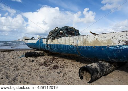 Old Fishing Canoe Docked At Boca Do Rio Beach.