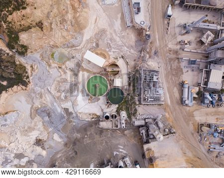 Quarry With Stone Sorting Conveyor Belts And An Open Pit Mine.