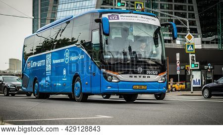 Modern Blue City Bus Of Moscow Public Transport System On The Route Near Moscow City Business Center
