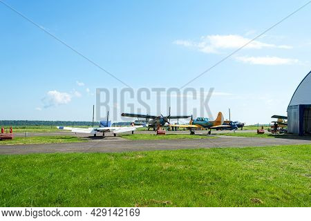 Gorodok. Ukraine. June 6, 2021. Tsuniv Airfield. Biplane, And A Training Aircraft, Parked At The Air