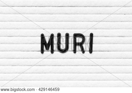 Black Alphabet Letter In Word Muri On White Felt Board Background