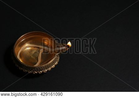 Lit Diya On Dark Background, Space For Text. Diwali Lamp