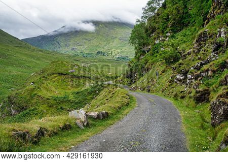 Single Track Road Going To Ballaghbeama Gap In County Kerry, Ireland