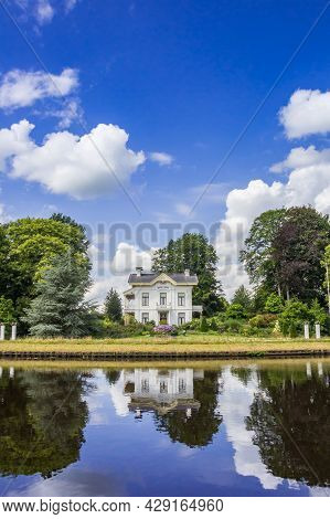 Tynaarlo, Netherlands - August 04, 2021: Historic White Mansion At The Noord-willems Canal In Drenth